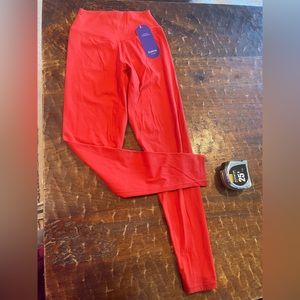 Coral colored leggings! Size small, brand new!  Very cute cut on the bum.